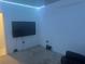 Media room with large TV and LED lighting at 45 Orchid Ct, Kissimmee, FL 34759