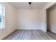 Minimalist bedroom with ample closet space and a bright window at 11 Locust Terrace Way, Ocala, FL 34472