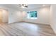 Bright living room with a large window and new floors at 11 Locust Terrace Way, Ocala, FL 34472