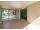 Covered patio featuring screened-in walls and sliding glass doors at 2060 Se 39Th St, Ocala, FL 34480