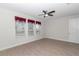 Bright bedroom with wood-look tile flooring and a ceiling fan at 4358 Nw 57Th Ave, Ocala, FL 34482