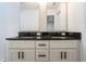 Bathroom vanity featuring dual sinks, granite countertops, and framed mirrors at 741 Ne 130Th Ter, Silver Springs, FL 34488