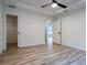 Bedroom with wood-look floors and featuring both closet and doorway entrances at 741 Ne 130Th Ter, Silver Springs, FL 34488