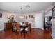 A warm dining room with a chandelier and a collection of personal photos decorating the walls at 9691 Sw 95Th Ct # A, Ocala, FL 34481