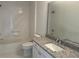 Bathroom with granite countertop vanity, and shower at 16862 Se 80 Bellavista Cir, The Villages, FL 32162
