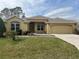 Charming single-story home with a well-maintained lawn and a cozy, welcoming exterior at 16862 Se 80 Bellavista Cir, The Villages, FL 32162