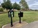 Scenic view of the golf course with meticulous landscaping and clear signage at 16862 Se 80 Bellavista Cir, The Villages, FL 32162