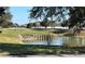 Picturesque golf course landscape with a serene pond and players enjoying the game at 16862 Se 80 Bellavista Cir, The Villages, FL 32162