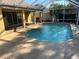 Inviting private screened pool with a spacious deck, perfect for relaxation and outdoor enjoyment at 16862 Se 80 Bellavista Cir, The Villages, FL 32162