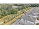 A view of a walking path running behind a row of houses in a community with mature trees at 5341 Nw 48Th Pl, Ocala, FL 34482
