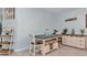 Charming dining area features a rustic table, stylish shelving, and neutral decor at 5341 Nw 48Th Pl, Ocala, FL 34482