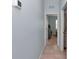 Neutral hallway leading to various rooms with tile flooring at 5341 Nw 48Th Pl, Ocala, FL 34482