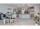 Spacious eat-in kitchen featuring a large island, stainless appliances, and gray cabinetry at 5341 Nw 48Th Pl, Ocala, FL 34482