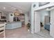 Open kitchen area with a granite island, stainless steel appliances and sight lines to the bedroom at 5341 Nw 48Th Pl, Ocala, FL 34482