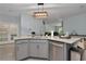 Spacious kitchen island with modern fixtures overlooks the adjacent living area at 5341 Nw 48Th Pl, Ocala, FL 34482