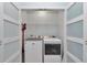 Convenient laundry room featuring modern washer and dryer, plus ample storage space at 5341 Nw 48Th Pl, Ocala, FL 34482