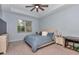 This spacious main bedroom features a ceiling fan, natural light, and space for a pet at 5341 Nw 48Th Pl, Ocala, FL 34482