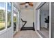 Bright sun room featuring glass sliders, a ceiling fan, and a view of the backyard at 5341 Nw 48Th Pl, Ocala, FL 34482