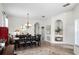 Elegant dining room with a chandelier, dark wood table, and ample seating at 2251 Oakington St, Winter Garden, FL 34787