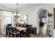 Bright dining area featuring a dark table and decorative chandelier at 2251 Oakington St, Winter Garden, FL 34787