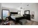 Spacious main bedroom featuring a ceiling fan, dark furniture, and a plush rug at 2251 Oakington St, Winter Garden, FL 34787