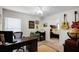 Office with guitars on wall, black desk with computer and views into the main bedroom at 2251 Oakington St, Winter Garden, FL 34787