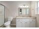 Bright bathroom features a shower and granite countertop vanity at 9481 Sw 93Rd Loop, Ocala, FL 34481