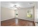 Spacious bedroom features two windows, ceiling fan and laminate flooring at 9481 Sw 93Rd Loop, Ocala, FL 34481