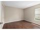 Empty bedroom with a window, closet, and wood style flooring at 9481 Sw 93Rd Loop, Ocala, FL 34481