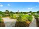 A beautifully landscaped community green space featuring an American flag and walking paths at 9481 Sw 93Rd Loop, Ocala, FL 34481