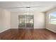 Dining room with hardwood floors, chandelier, and sliding glass doors to screened lanai at 9481 Sw 93Rd Loop, Ocala, FL 34481