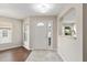 Bright entryway with tiled floor, side windows, and a view into the living spaces at 9481 Sw 93Rd Loop, Ocala, FL 34481