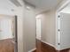 Hallway with views of kitchen, rooms, and hardwood style flooring at 9481 Sw 93Rd Loop, Ocala, FL 34481