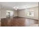 Open living room with sleek flooring, neutral tones, and a view of the screened lanai, perfect for entertaining at 9481 Sw 93Rd Loop, Ocala, FL 34481