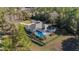 Aerial view of the screened-in pool and fence surrounding the back of the home at 12880 Sw 66Th St, Ocala, FL 34481