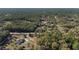 Home on a private lot surrounded by mature trees. Includes a long driveway and side entry garage at 12880 Sw 66Th St, Ocala, FL 34481