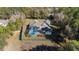 Aerial view of the screened-in pool and fence surrounding the home's landscaped backyard at 12880 Sw 66Th St, Ocala, FL 34481