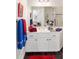 Bright bathroom with a white vanity, decorative towels, and modern fixtures at 12880 Sw 66Th St, Ocala, FL 34481