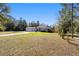 Single-story home with a well-manicured front lawn and circular driveway at 12880 Sw 66Th St, Ocala, FL 34481