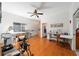 Spacious flex space with hardwood floors used as a sewing room and workout area at 12880 Sw 66Th St, Ocala, FL 34481