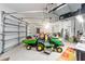 Spacious three-car garage with lawn equipment at 12880 Sw 66Th St, Ocala, FL 34481