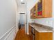 Hallway showcasing a wooden counter and cabinet at 12880 Sw 66Th St, Ocala, FL 34481