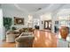 Bright and airy living room with hardwood floors and views of the entryway and office at 12880 Sw 66Th St, Ocala, FL 34481