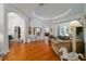 Expansive living room with hardwood floors and arched doorways and large windows at 12880 Sw 66Th St, Ocala, FL 34481