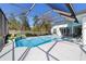 Enjoy the pool and patio, perfect for outdoor entertaining and relaxation at 12880 Sw 66Th St, Ocala, FL 34481
