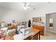 Sewing room with multiple sewing machines, crafting tables, and organization units at 12880 Sw 66Th St, Ocala, FL 34481