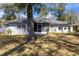 Spacious backyard features mature trees and room to relax at 1762 Ne 39Th St, Ocala, FL 34479