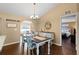 Dining room with a stylish chandelier and decor with a view leading into the Primary bedroom at 1762 Ne 39Th St, Ocala, FL 34479