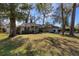Charming single-story home with a well-maintained lawn, mature trees, and attached two-car garage at 1762 Ne 39Th St, Ocala, FL 34479