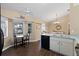 Open kitchen with eat-in area featuring wood floors, modern appliances, and a view into the living room at 1762 Ne 39Th St, Ocala, FL 34479